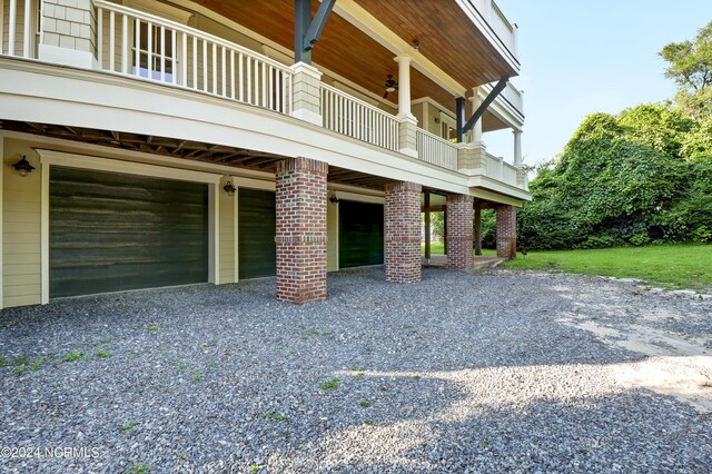 view of side of property with a balcony