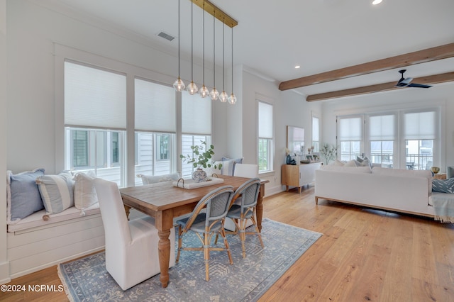 dining space featuring light wood finished floors, beamed ceiling, visible vents, and recessed lighting