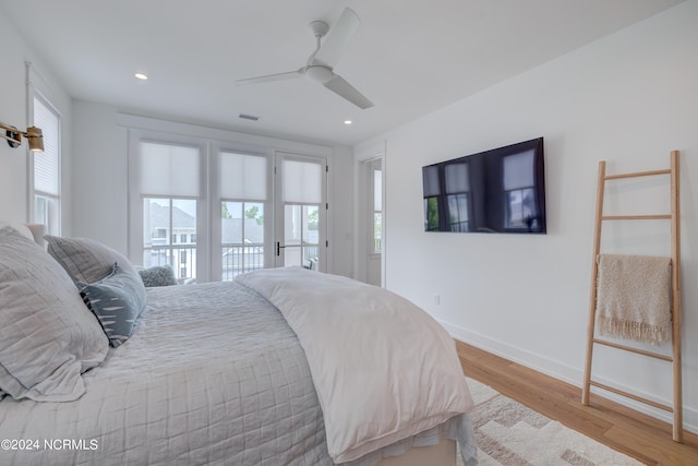 bedroom featuring light wood finished floors, baseboards, visible vents, access to exterior, and recessed lighting