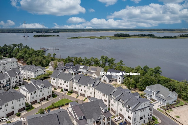 birds eye view of property with a water view and a residential view