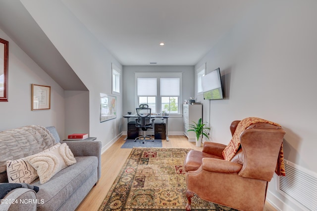 office featuring recessed lighting, light wood-type flooring, visible vents, and baseboards