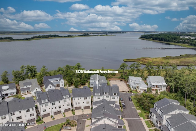 birds eye view of property featuring a water view and a residential view