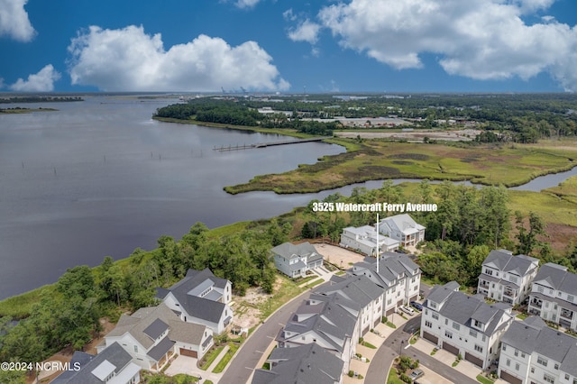 bird's eye view with a water view and a residential view