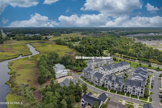 bird's eye view featuring a water view and a residential view