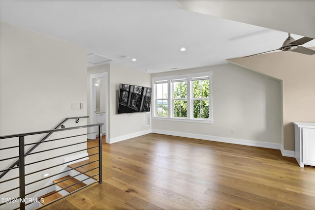 interior space featuring light wood-style flooring, baseboards, a ceiling fan, and recessed lighting