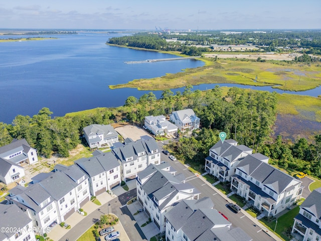 drone / aerial view with a water view and a residential view