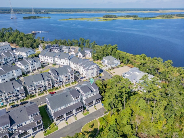 drone / aerial view with a water view and a residential view