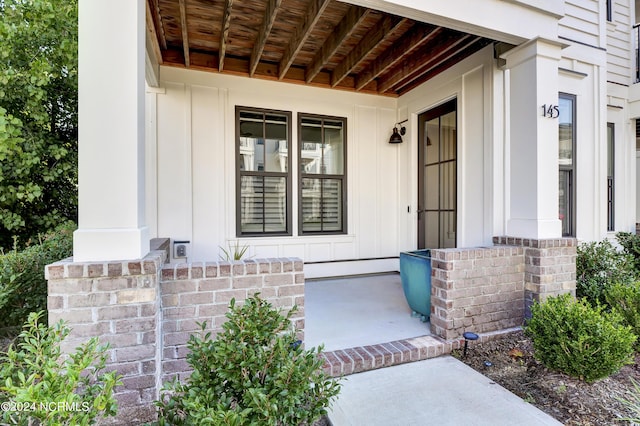 doorway to property with board and batten siding