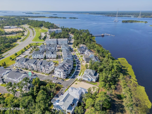 drone / aerial view with a water view and a residential view