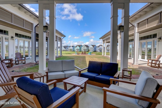 view of patio featuring a residential view, french doors, and an outdoor living space