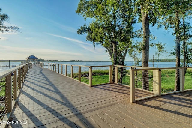 view of dock with a water view and a gazebo