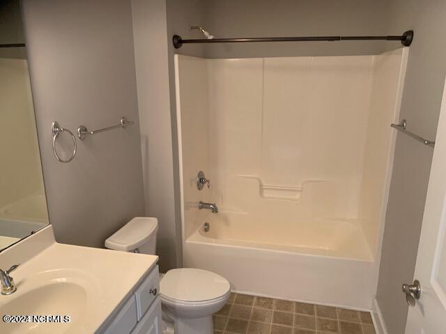 full bathroom featuring vanity, toilet, and bathtub / shower combination