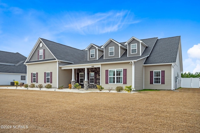 cape cod-style house with central AC and a front lawn