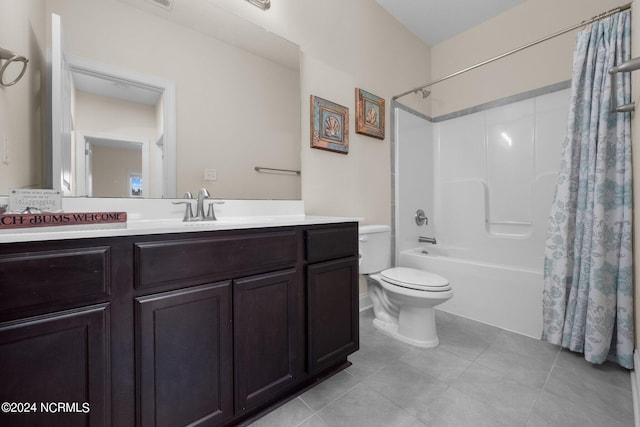 full bathroom featuring vanity, toilet, tile patterned floors, and shower / tub combo with curtain