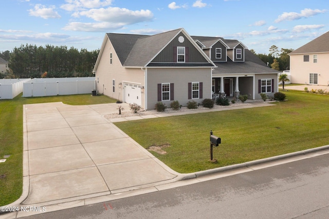 view of front of home with a garage and a front lawn