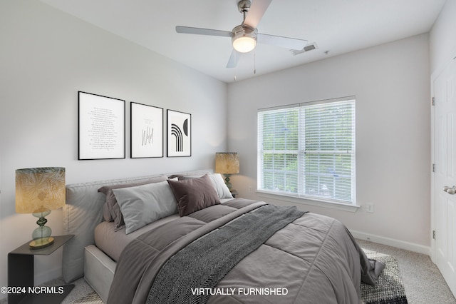 carpeted bedroom with ceiling fan