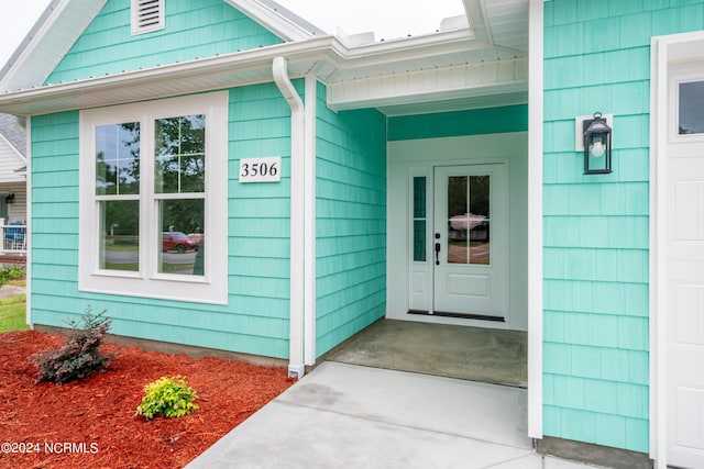 property entrance with a garage