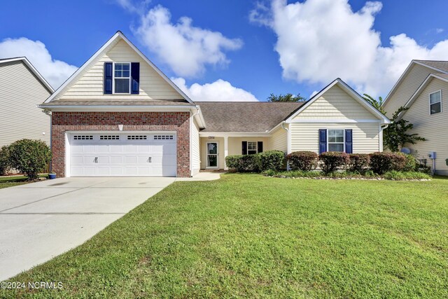 view of front facade with a front lawn and a garage