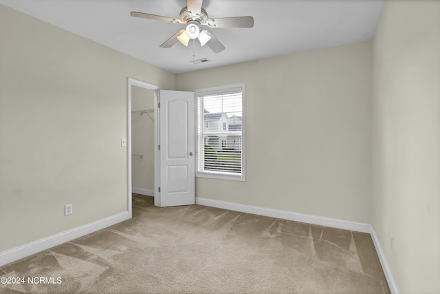 unfurnished room featuring light carpet, visible vents, and baseboards