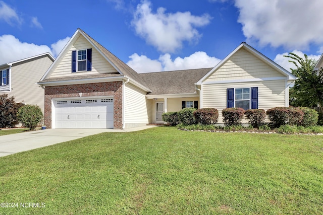 view of front of house with a front yard, concrete driveway, and brick siding