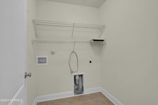 laundry room featuring laundry area, gas dryer hookup, hookup for a washing machine, tile patterned flooring, and hookup for an electric dryer