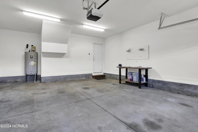 garage featuring a garage door opener and electric water heater