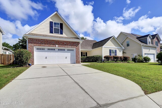 view of front property with a garage and a front yard