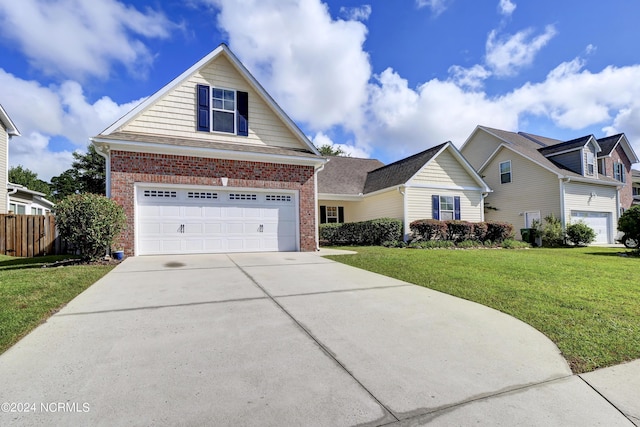 view of front of house with driveway, brick siding, and a front yard