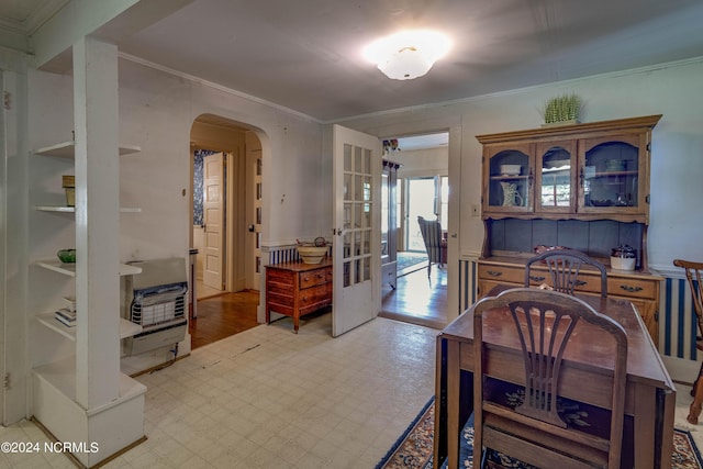 212 S Main St, Bath, NC 27808 - dining area with arched walkways, ornamental molding, french doors, and light flooring