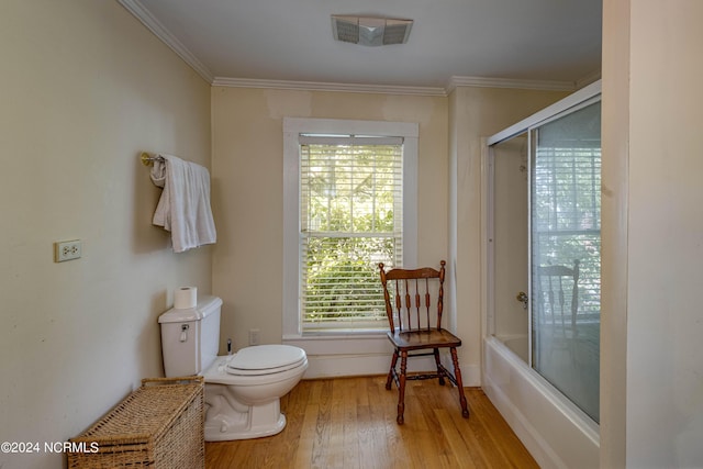 212 S Main St, Bath, NC 27808 - bathroom with wood finished floors, crown molding, and bath / shower combo with glass door