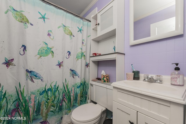 bathroom with vanity, tasteful backsplash, tile walls, toilet, and ornamental molding