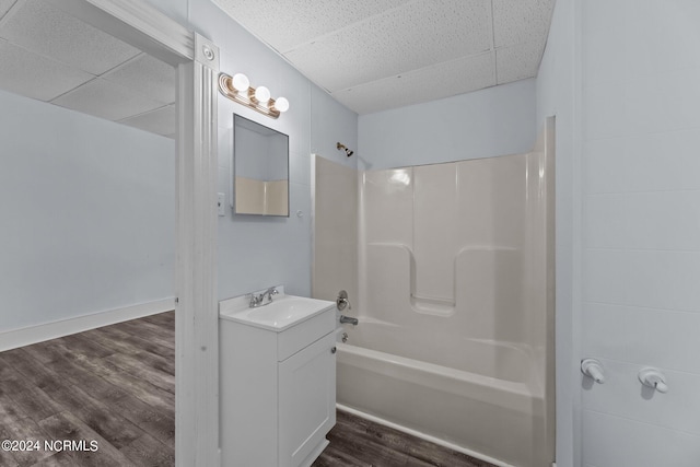 bathroom featuring hardwood / wood-style floors, bathing tub / shower combination, and vanity