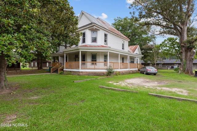 view of front of house with a porch and a front lawn