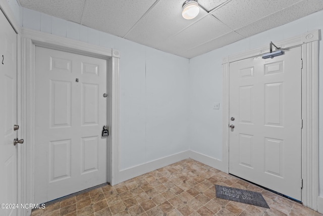 entrance foyer featuring a drop ceiling