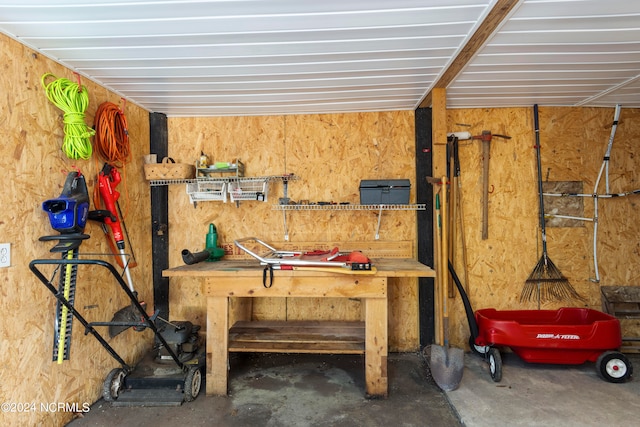 interior space with concrete flooring and a workshop area