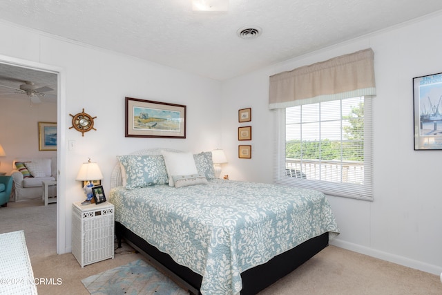 carpeted bedroom with a textured ceiling