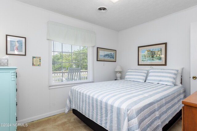 bedroom with light carpet