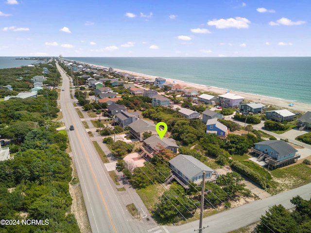 bird's eye view featuring a water view and a view of the beach