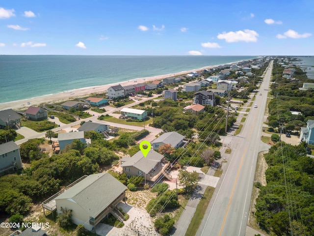 aerial view featuring a water view and a beach view