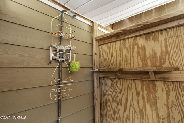 details featuring wood walls