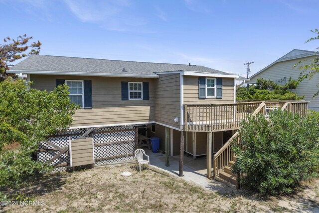 rear view of property with a deck