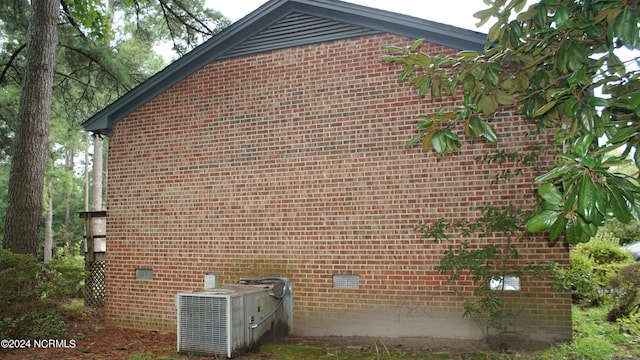 view of side of property with central AC