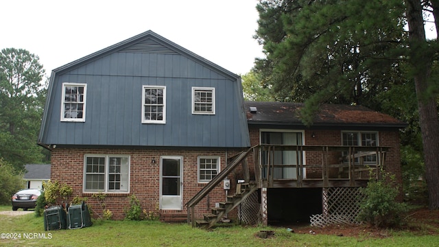 back of house featuring a yard