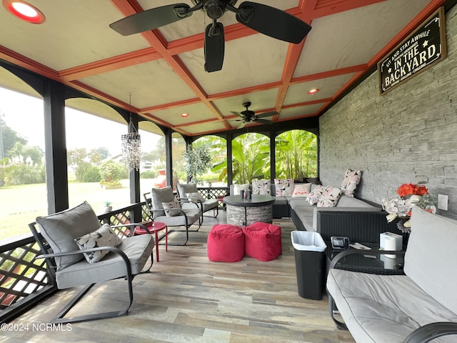 wooden deck featuring ceiling fan and an outdoor living space