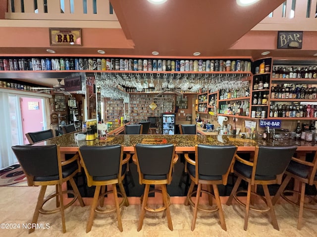 bar with light tile patterned floors