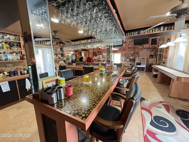 kitchen featuring ceiling fan and light tile patterned floors