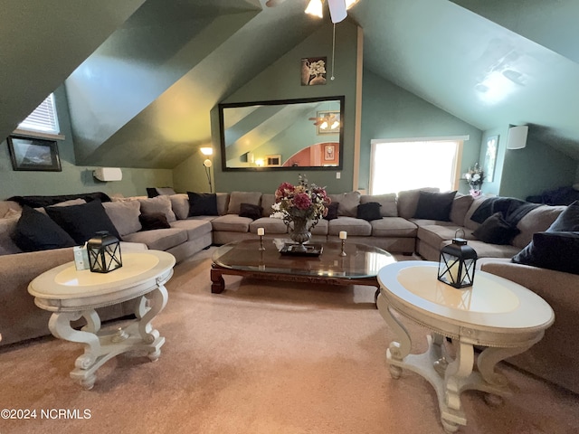 carpeted home theater room with vaulted ceiling