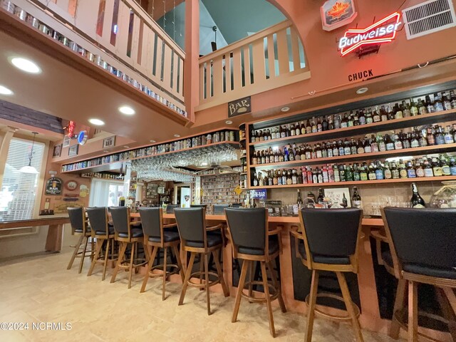 bar with light tile patterned floors