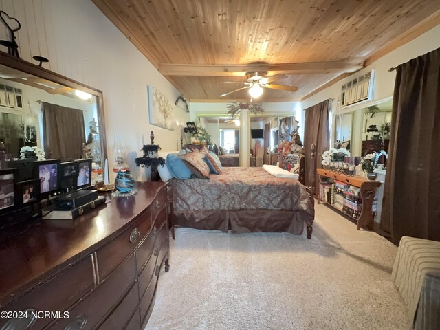 carpeted bedroom featuring wood ceiling, ceiling fan, and a wall mounted AC