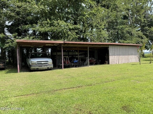 view of outbuilding with a yard